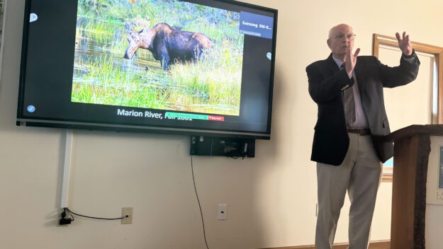 Al Hicks talks about climate change and wildlife at the Lake George Land Conservancy office in Bolton Landing. Photo by Mike Lynch
