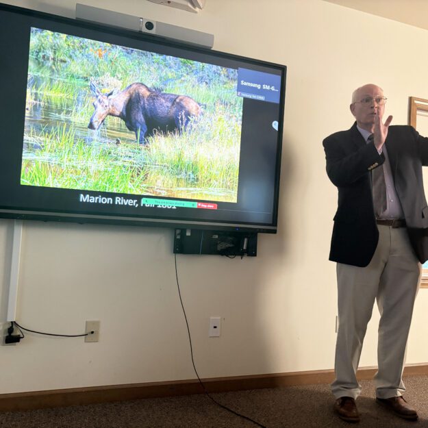 Al Hicks talks about climate change and wildlife at the Lake George Land Conservancy office in Bolton Landing. Photo by Mike Lynch