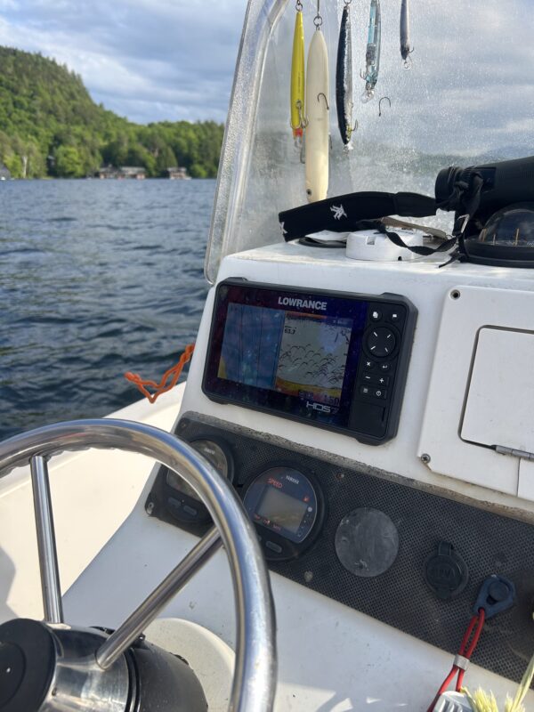 a boat on lake placid looking for lake trout
