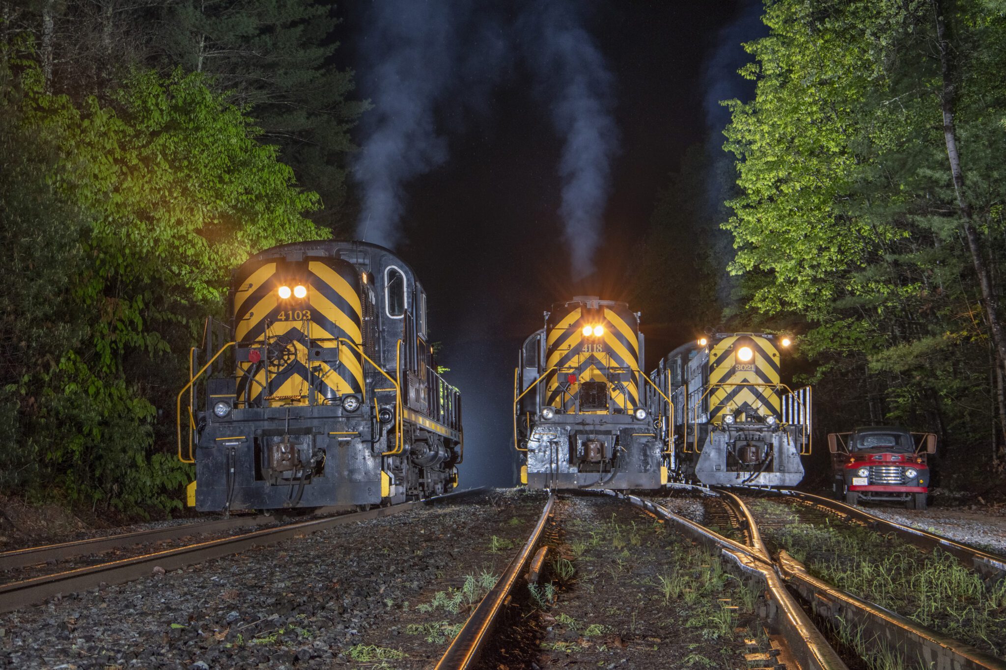 Trains in yard at night