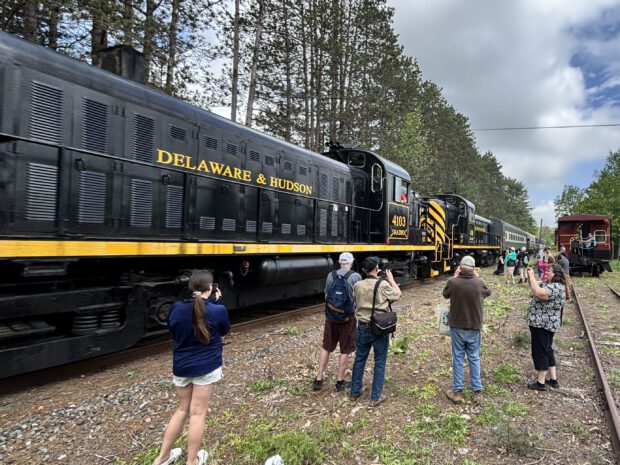 Passengers looking at train