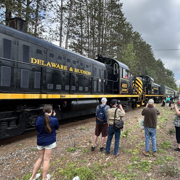 Passengers looking at train