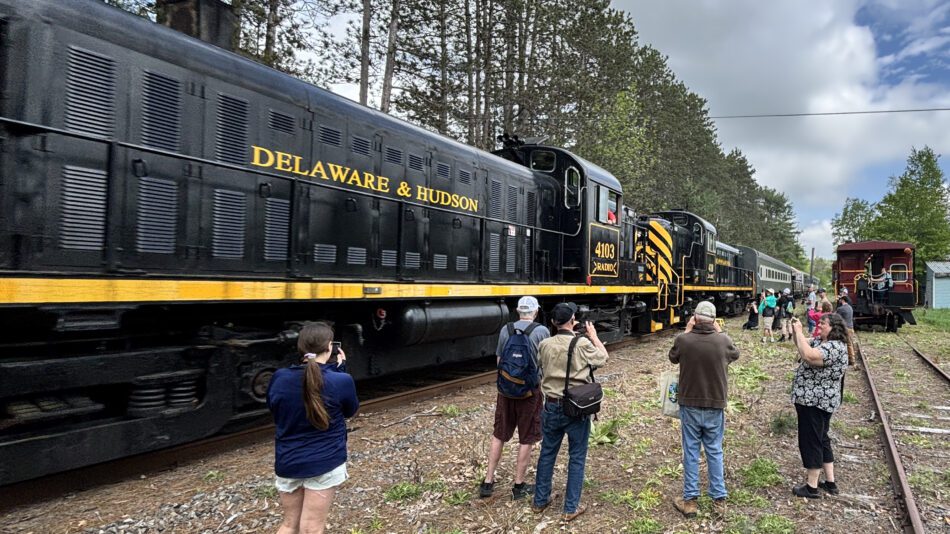Passengers looking at train