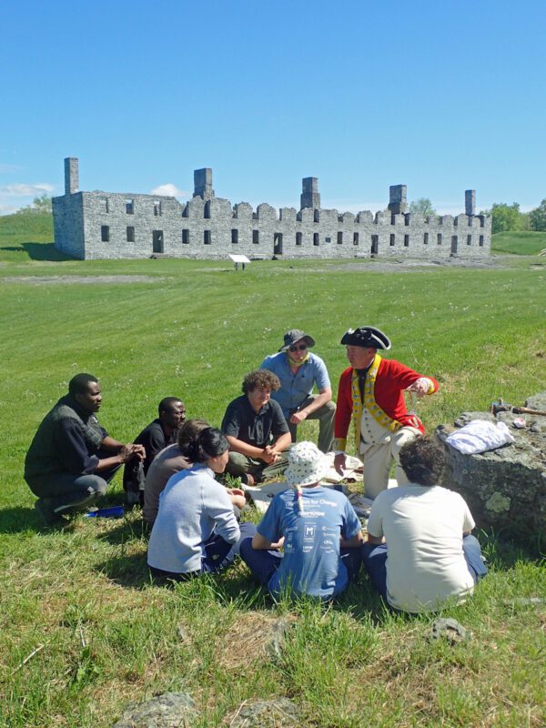 Re-enactor with students