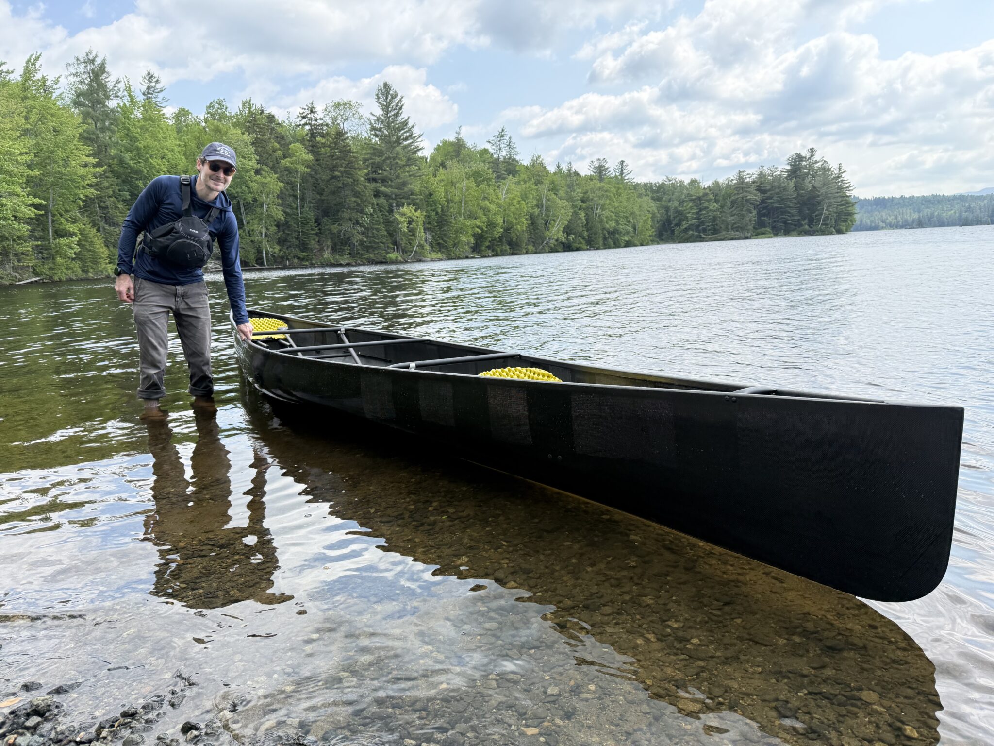 man with a canoe in the water