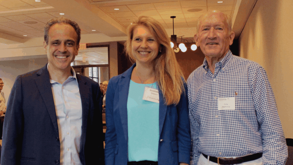 From the left, man with dark suit jacket and button up shirt, woman in light blue shirt and dark blue blazer, older man with button up shirt and belted khakis