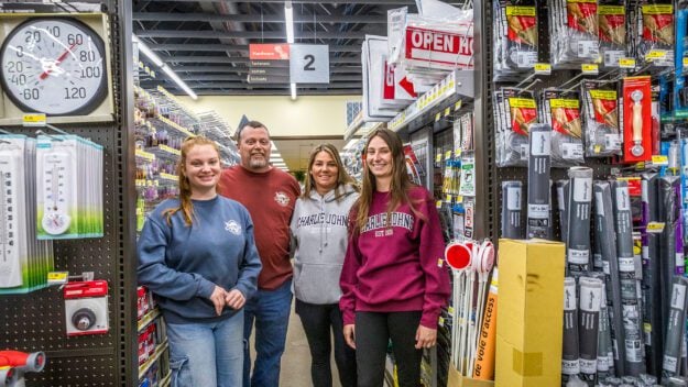 Charlie Johns Store, a general store in Speculator NY, southern Adirondacks. Owner Jonathan Lane (orange/rust shirt) with his wife Lynn Lane (gray sweatshirt) and their daughters Morgan Lane (red shirt) and x Lane (blue shirt, red hair)who all work at the store.