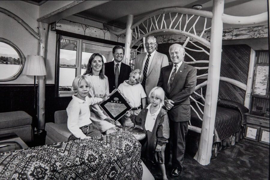 The Mirror Lake Inn in Lake Placid NY is a generational family business.This photo is from the 1990s. Lisa and Ed Weibrecht with their young sons Andrew, Jonathan and Ethan posing with a AAA Award presented to them by the AAA (2 men on right).  photo by Nancie Battaglia