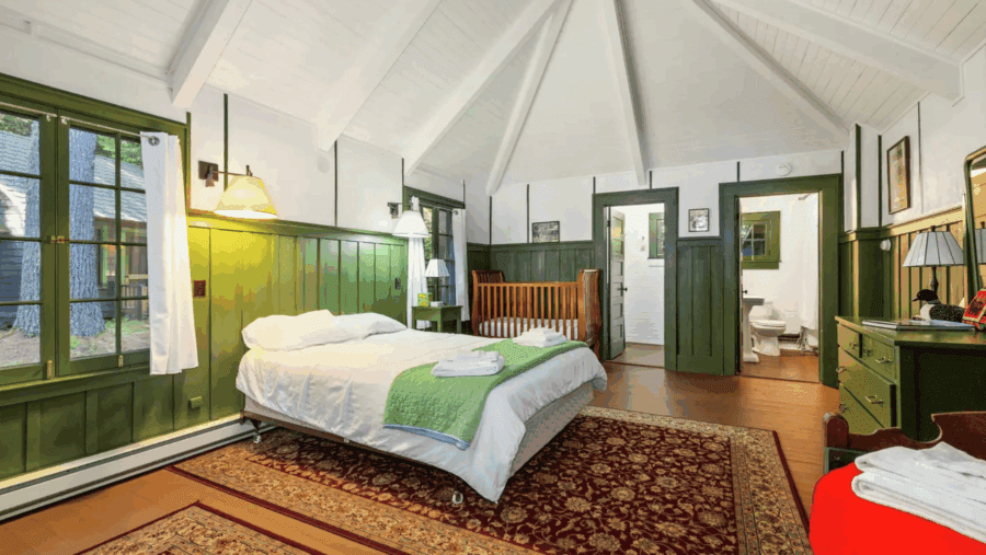 Bedroom at Camp Iroquois in Saranac Lake.  Photo by Jordan Craig, courtesy of Platinum Luxury Auctions