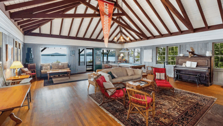 Interior room with vaulted tudor ceilings and view of the lake 