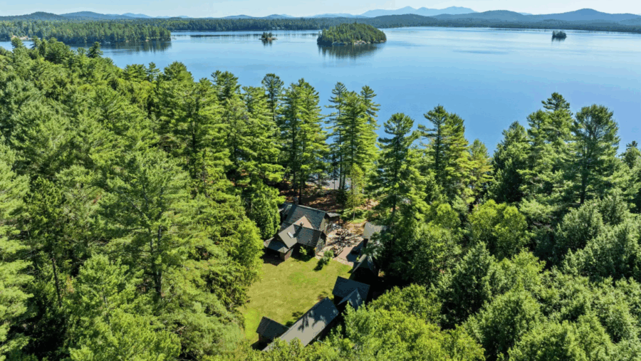 Aerial of Camp Iroquois in Saranac Lake, a historic 4,000-square-foot Great Camp nestled on 8.6 secluded, wooded acres. Currently listed for $4.25 million, the property is being auctioned on Sept. 23 without reserve. Jordan Craig/Platinum Luxury Auctions