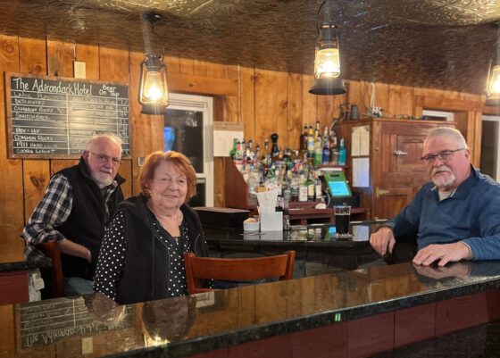 Carol Young (middle) at the Adirondack Hotel bar.