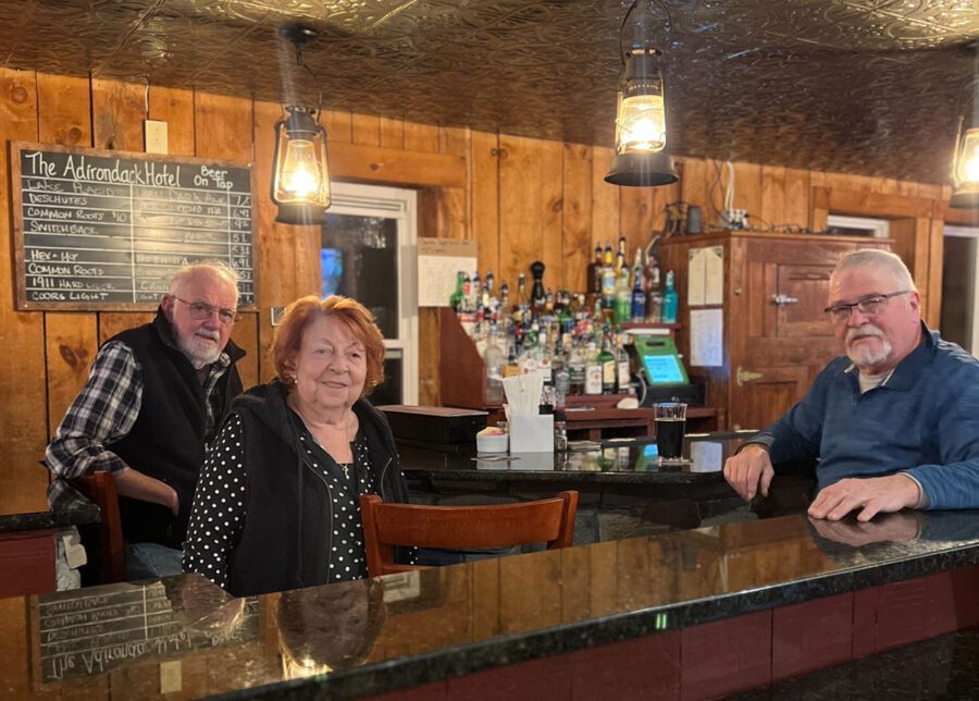 Carol Young (middle) at the Adirondack Hotel bar.