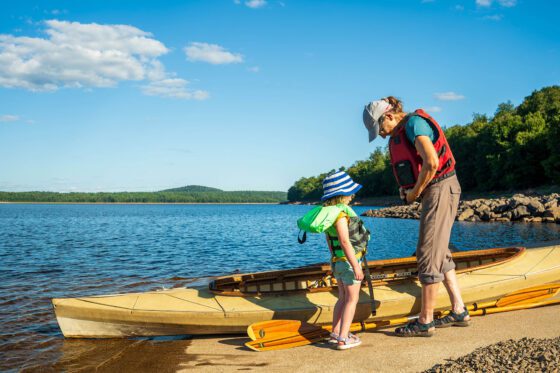 Girl getting life jacket on at carry falls reservoir