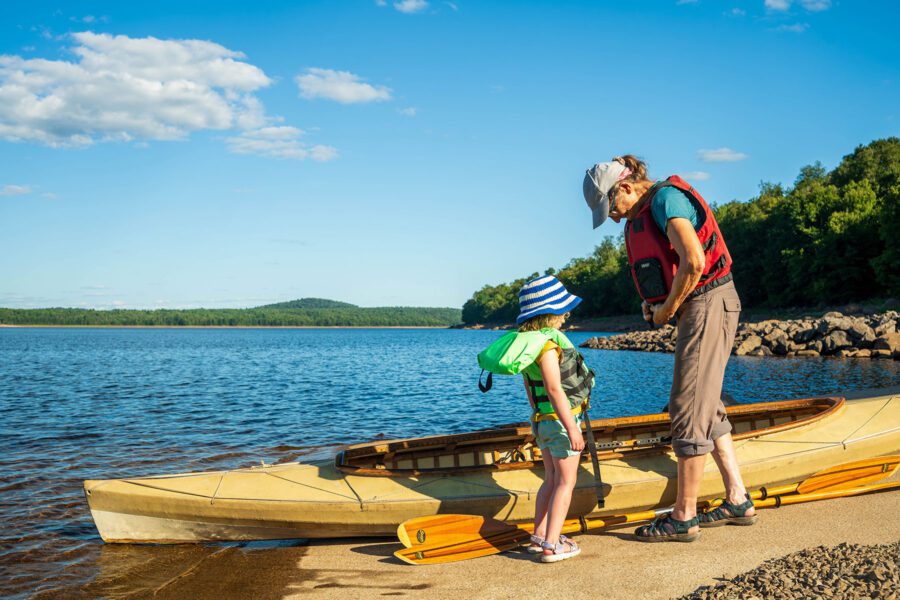Girl getting life jacket on at carry falls reservoir